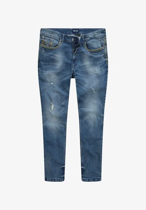 Jeans de mezclilla azul con un corte slim. Las características notables incluyen parches desgastados, decoloración y costuras amarillas en los bolsillos frontales y la bragueta.