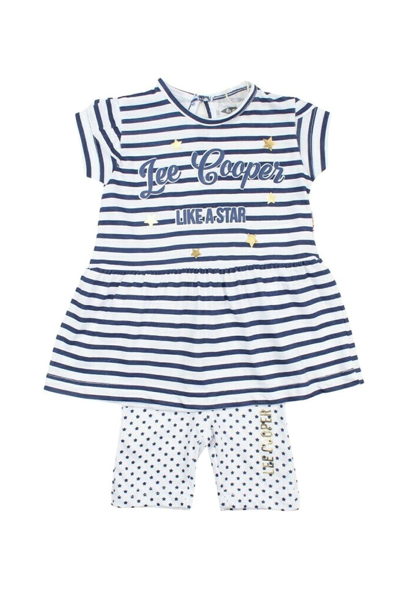 Robe rayée bleu marine et blanche à manches courtes, ornée d'étoiles dorées et de texte. Associée à des leggings blancs à pois.