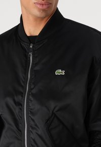 Lacoste Bomber bunda - black