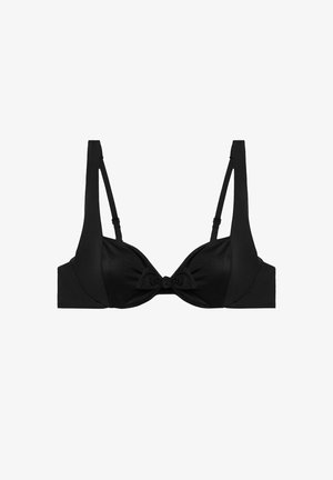 Soutien-gorge noir en tissu lisse, avec des bretelles larges, un détail en nœud au centre et une conception structurée avec armatures pour le soutien.