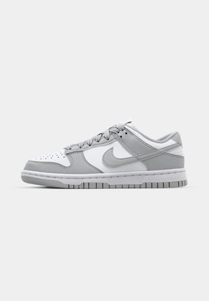 Gray and white low-top sneakers with leather and suede materials, perforated toe box, and rubber outsole. Features prominent swoosh logo.