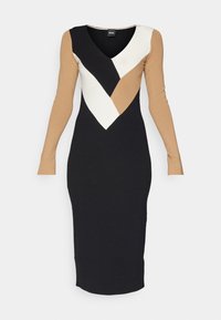 Robe midi noire avec manches longues couleur beige et décolleté en V présentant un motif chevron blanc, noir et beige sur le haut du corps.