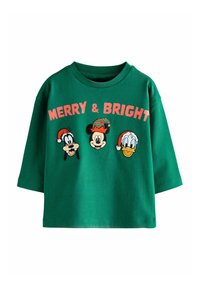 Roheline puuvillane T-särk, millel on suur lõige, ümmargune kaelus ja tikitud Disney tegelased pidulike mütsidega, millel on silt "MEELDIB JA KIRG".