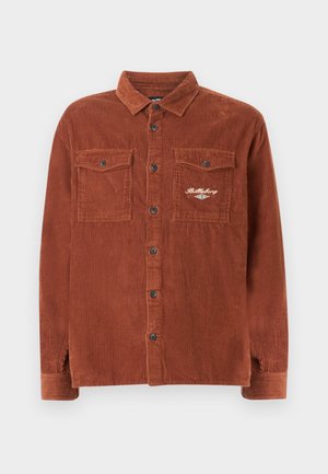 Košile z hnědého manšestru se zapínáním na knoflíky, dvě kapsy na prsou, jedna s vyšitým logem "Billabong".