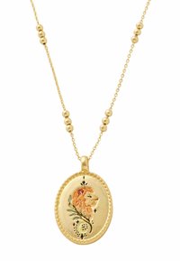 Gold necklace featuring an oval pendant with a lion illustration, detailed floral accents, and a beaded chain for added texture.