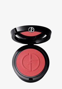 Rund svart kompakt som inneholder rosa blush med en subtil glans. Har en logo preget i blushen. Glatt tekstur og fast konsistens.