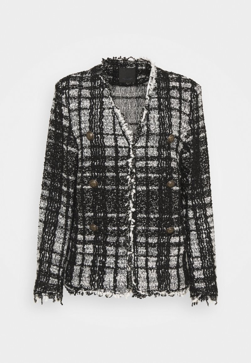 Veste à carreaux noir et blanc en tissu texturé, avec un design court, une fermeture double boutonnage et des boutons dorés.