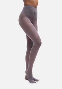 Γκρί αδιαφανές καλσόν με ψηλή μέση, ομαλή υφή και χωρίς ορατά σχέδια, που αναδεικνύει εφαρμοστή γραμμή από τη μέση μέχρι τους αστραγάλους.