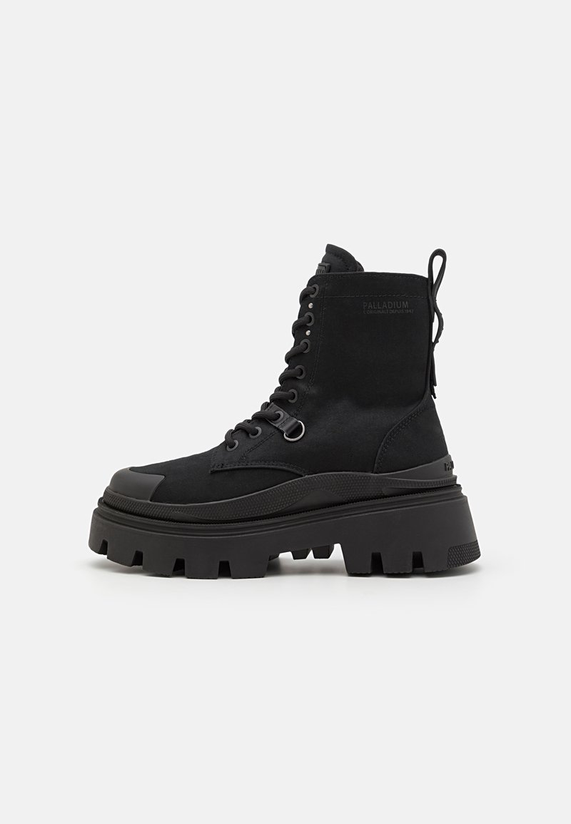 Black lace-up ankle boot with a chunky rubber sole, suede upper, and a loop tab on the back; features reinforced toe and textured accents.