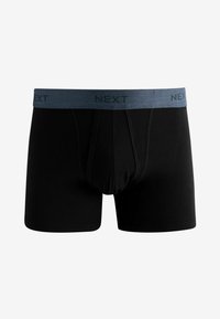 Boxers noirs en tissu doux avec une ceinture élastique grise comportant le logo "NEXT" en relief. Pas de motifs ou d'accents visibles.