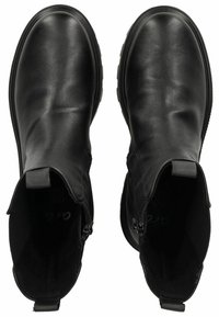 Botas de tobillo de cuero negro con una textura suave, punta redondeada, cremalleras laterales y tiradores para poner y quitar fácilmente. Suela de goma plana para mayor estabilidad.