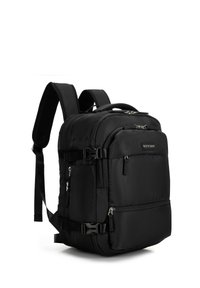 Zaino nero di forma rettangolare, realizzato in tessuto resistente. Dotato di numerosi tasche con cerniera e spallacci imbottiti regolabili.