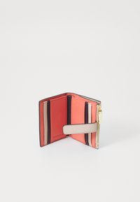 Compact wallet in multicolored leather, featuring vertical stripes in red, pink, and beige, with a zip closure and a snap strap.