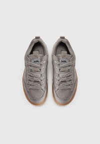 Gray suede sneakers with a textured finish, round laces, padded collar, and rubber sole. Distinctive logo on the tongue. Top view.