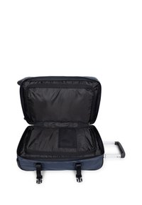 Marineblauer Koffer auf Rädern mit ausziehbarem Griff, schwarzer Innenauskleidung und Netzfach. Reißverschlusstaschen, stabile Gurte und glatte Oberfläche.