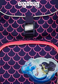 Purple backpack with pink scallop pattern, featuring a bright pink zipper and a graphic of a mermaid with a seahorse on a blue cloud background.