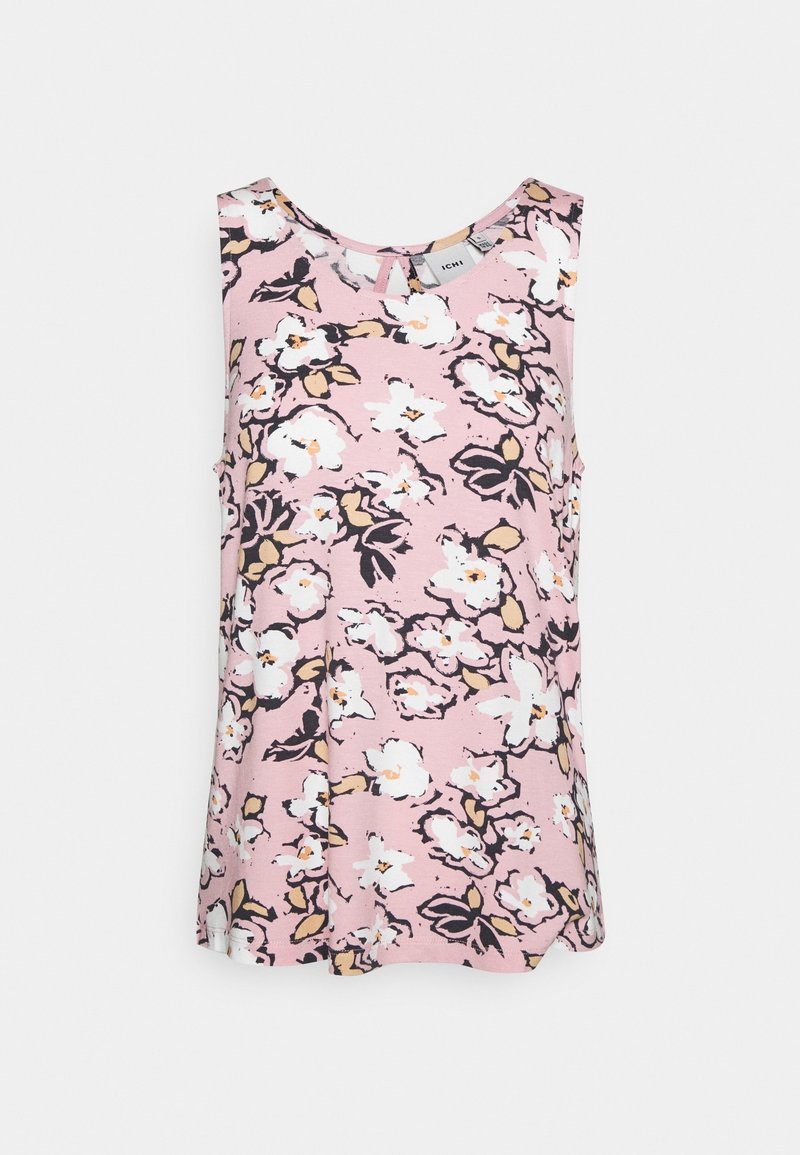 Haut sans manches à fleurs rose avec des motifs de fleurs blanches et noires, un col rond et des fentes sur les côtés pour plus de liberté de mouvement.