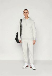 Puma HYROX SWEATPANT - Pantalones deportivos - light gray heather
