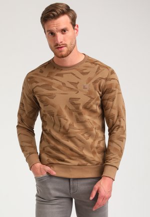 Sudadera marrón con un patrón geométrico en diferentes tonalidades, cuello redondo y puños acanalados, con una etiqueta en el bolsillo del pecho.
