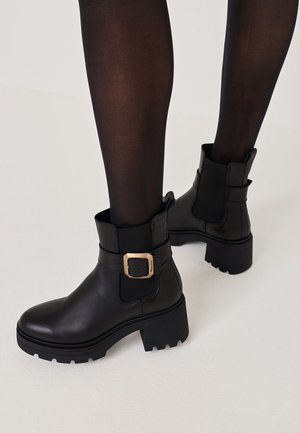 Tamaris Platvormtallaga poolsaapad - black
