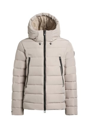 Beige puffer-takki hupulla, jossa on vaakasuoria tikattuja osioita, mustat vetoketjut ja etutaskut. Sujuva kankaan rakenne.