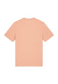 T-shirt à manches courtes en tissu doux pêche, présentant un col rond et un dos uni sans motifs ni embellissements.