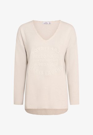 Beige long-sleeve V-neck sweater with a slightly textured finish. Features embossed text pattern on the front and an uneven hemline.
