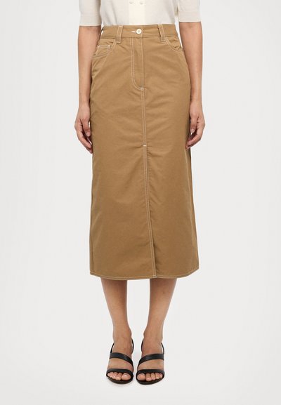 Khaki midi seelik, mis on valmistatud puuvillase twillkangast, ees on taskud, valged õmblused, taljes nööpkinne ja sirge lõige.