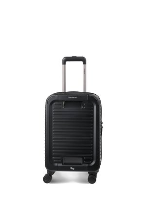 Valise cabine rigide noire avec poignée extensible et quatre roues, conçue pour une parfaite maniabilité et un confort de voyage.