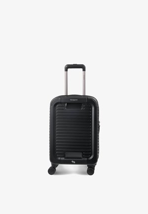 Valise cabine rigide noire avec poignée extensible et quatre roues, conçue pour une parfaite maniabilité et un confort de voyage.