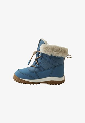 Blauer wasserdichter Winterstiefel mit weichem beigen Fellbesatz, strukturiertem Stoff, verstärkter Zehenkappe und einer robusten Gummisohle mit rutschfestem Profil.