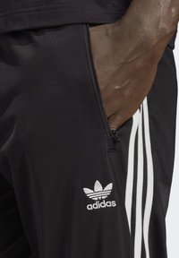 adidas Originals FIREBIRD TP - Tracksuit bottoms - black