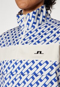 J.LINDEBERG Sports MINNA ANORAK - Windbreaker - moonbeam
