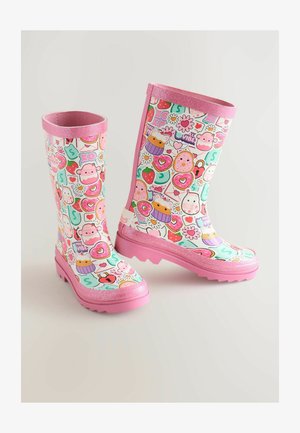 Las botas de lluvia de goma presentan un patrón colorido de dulces, corazones y animales sobre un fondo menta. El ribete de purpurina rosa añade un detalle especial.
