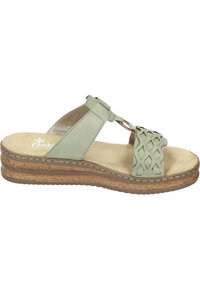 Light green slide sandal made of leather and cork. Features a woven strap design and a cushioned footbed on a layered wedge sole.