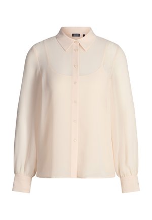 Cremefarbene Langarmbluse mit spitzem Kragen, durchgeknöpftem Vorderteil und taillierten Manschetten, gefertigt aus leichtem, transparentem Stoff.