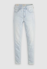 Φωτεινό γαλάζιο ψηλόμεσο στενό τζιν με τσέπες μπροστά και πίσω κ αι κλείσιμο με κουμπί και φερμουάρ σε απλό φόντο.