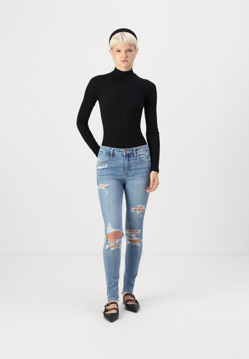 Jean Femme American Eagle Jegging Taille 0 - Super Stretch, Délavé Moyen, Entrejambe 28.75", Occasion Excellent état