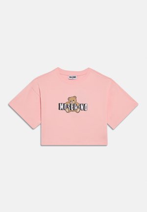 Pink cropped t-shirt made of cotton with short sleeves, featuring a bear graphic and "Moschino" text in bold black font.