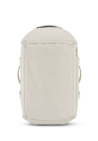Sac à dos beige clair en tissu texturé, avec un dessus arrondi, des poignées sur les côtés et une fermeture éclair à l'avant. Design simple et minimaliste.