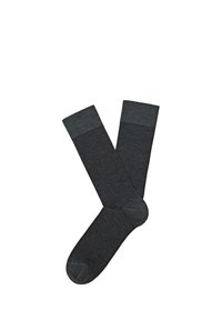 Calzini al ginocchio di colore grigio scuro con un corpo testurizzato e polsini a coste lisce a contrasto. Realizzati in materiale morbido ed elastico per garantire comfort.