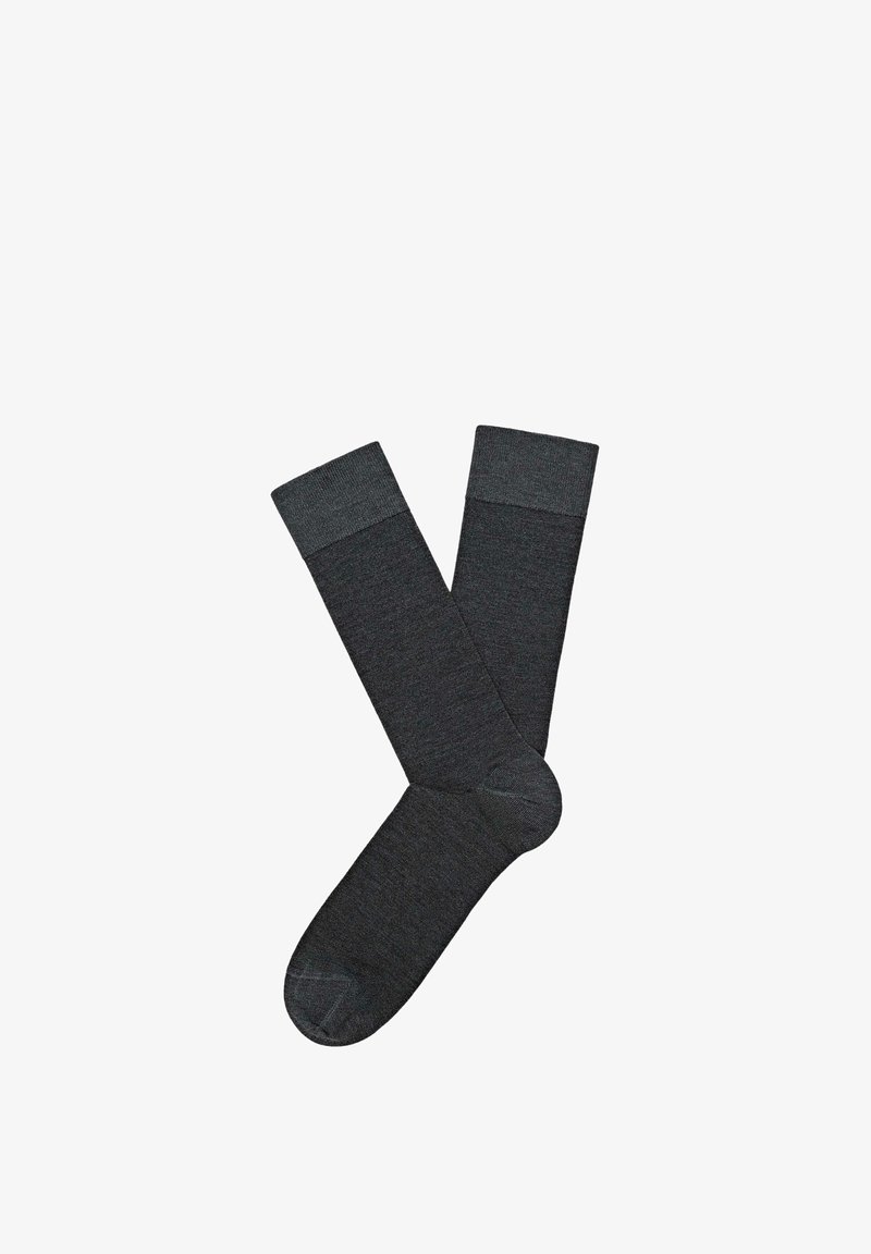 Mørkegrå knæstrømper med tekstureret overflade og kontrasterende glatte ribbede manchetter. Fremstillet af blødt, elastisk materiale for komfort.