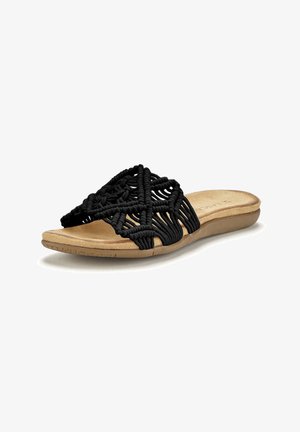 Schwarze Makramé-Rutschsandale mit geometrischem Design und beigem gepolstertem Fußbett. Flexibel, offenes Zehenstück, mit gewebter Textur und niedrigem Profil.