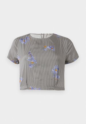 Striped cropped top in black and white with blue floral print and orange accents. Short sleeves, round neckline, lightweight fabric.