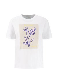 Bílý bavlněný tričko s květinovým potiskem v purpurové na béžovém pozadí, s nápisem "BLOOM" nahoře a menším textem dole.