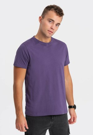Purple cotton t-shirt with a crew neckline and short sleeves. The fabric appears smooth and lightweight, providing a casual fit.