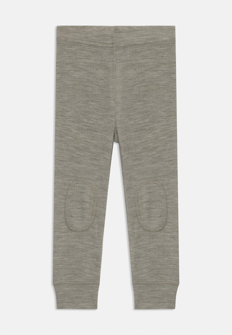 Grå leggings av mjukt, texturerat tyg, med knäflikar och åtsittande muddar vid anklarna. Designade för komfort och hållbarhet.