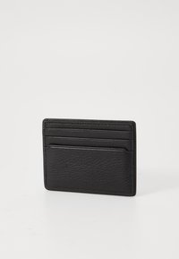 Black leather cardholder with a textured finish, featuring multiple card slots and a sleek rectangular shape. No visible hardware.