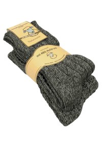 Grau gestrickte Socken mit Rippstruktur, versehen mit einem Etikett, das ein Schaf darstellt und Informationen über das rutschfeste Design enthält.