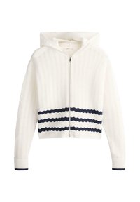 Sweat à capuche blanc zippé avec motif ondulé texturé, comportant trois bandes noires horizontales près de la taille et une bordure noire aux poignets.